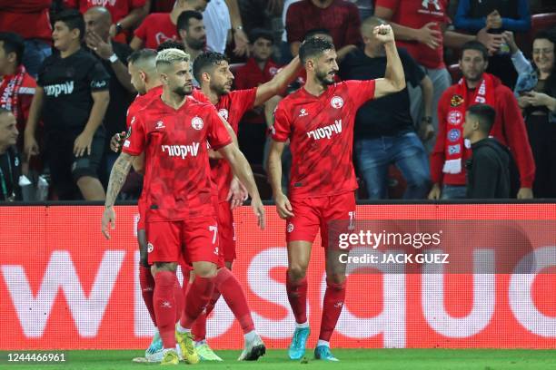 Hapoel Beer-Sheva's Israeli forward Sagiv Yehezkel celebrates the opening goal during the UEFA Europa Conference League football match between...