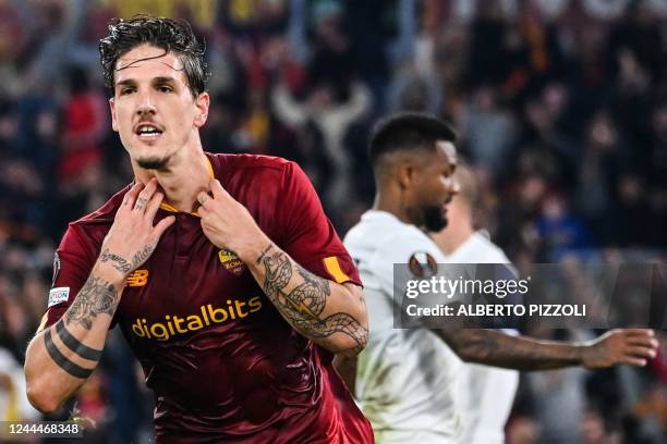 Roma's Italian midfielder Nicolo Zaniolo celebrates after scoring his side's third goal during the UEFA Europa League Group C football match between...