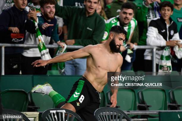 Real Betis' French midfielder Nabil Fekir celebrates with supporters scoring his team's third goal during the UEFA Europa League 1st round group C...