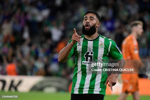 Real Betis' French midfielder Nabil Fekir celebrates scoring his team's third goal during the UEFA Europa League 1st round group C football match...