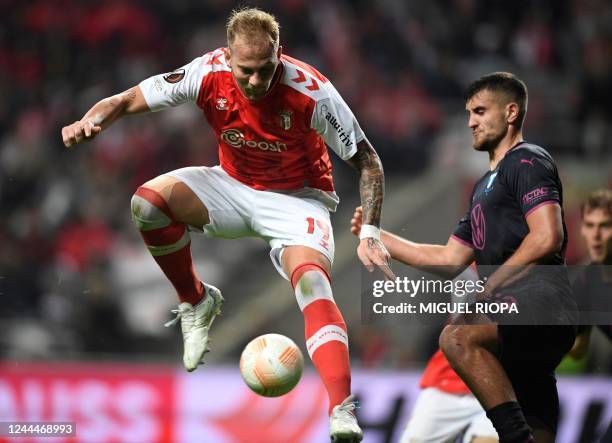 Sporting Braga's Serbian midfielder Uros Racic vies with Malmo FF's Czech defender Matej Chalus during the UEFA Europa League 1st round group D...