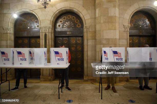Voters fill out mail-in ballots at the Board of Elections office in the Allegheny County Office Building on November 3, 2022 in Pittsburgh,...