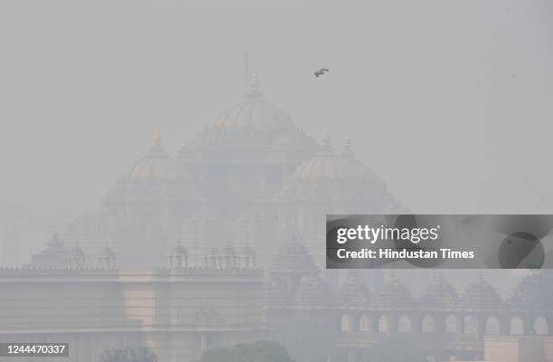View of the Akshardham temple shrouded in a layer of smog on November 3, 2022 in New Delhi, India. The Commission for Air Quality Management released...