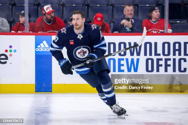 Pierre-Luc Dubois of the Winnipeg Jets takes part in the pre-game warm up prior to NHL action against the Montreal Canadiens at the Canada Life...