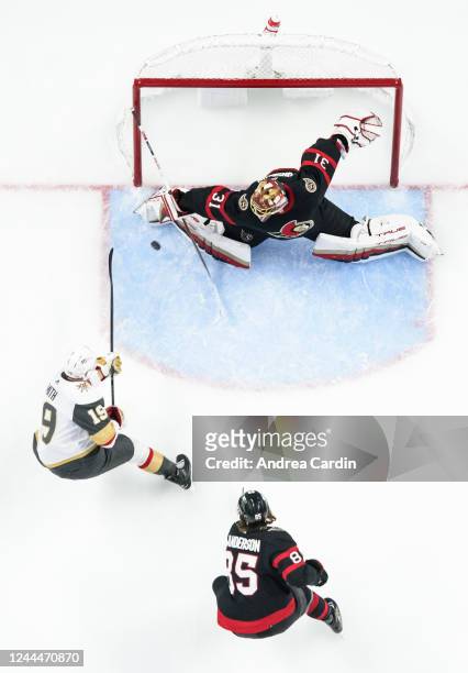 Reilly Smith of the Vegas Golden Knights scores on Anton Forsberg of the Ottawa Senators as he is chased down by Jake Sanderson at Canadian Tire...