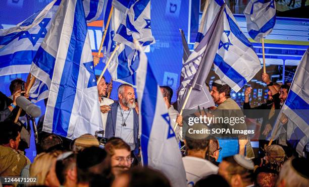 Supporters of the ultranationalist party Otzma Yehudity celebrate in Jerusalem after hearing the results of the exit polls giving their party 14...