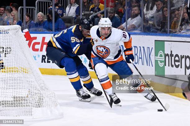 Kyle Palmieri of the New York Islanders controls the puck as Colton Parayko of the St. Louis Blues pressures at the Enterprise Center on November 3,...
