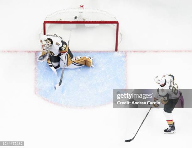 The puck hits the back of the net behind Logan Thompson of the Vegas Golden Knights after a shot from Claude Giroux of the Ottawa Senators as Alec...