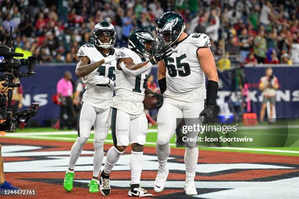 Philadelphia Eagles offensive tackle Lane Johnson congratulates Philadelphia Eagles running back Kenneth Gainwell following a late first half rushing...