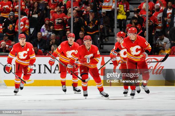 Blake Coleman of the Calgary Flames celebrates with teammates after a goal against the Nashville Predators at Scotiabank Saddledome on November 3,...