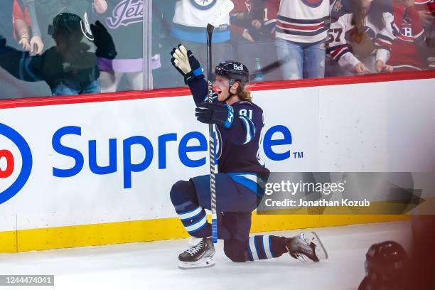 Kyle Connor of the Winnipeg Jets celebrates his overtime winning goal against the Montreal Canadiens at the Canada Life Centre on November 3, 2022 in...