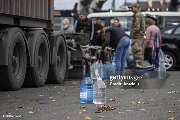 Ukrainian citizens carry bottles and buckets to receive clean water as Russia-Ukraine war continue in Mykolaiv, Ukraine on November 03, 2022. Water...