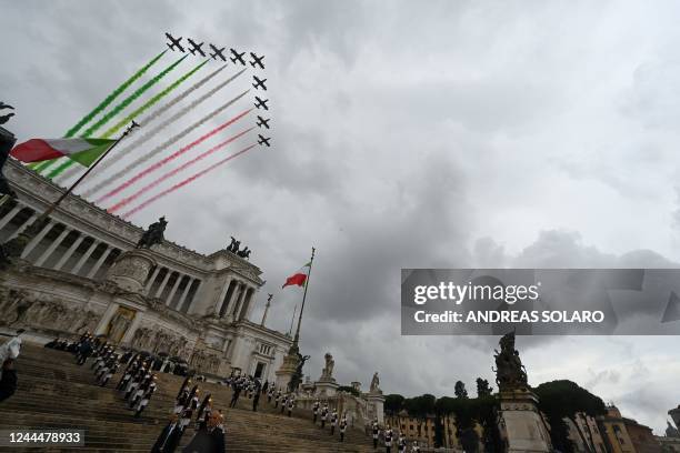 Planes of the Italian Air Force aerobatic unit Frecce Tricolori spread smoke with the colors of the Italian flag as they fly over the Altare della...