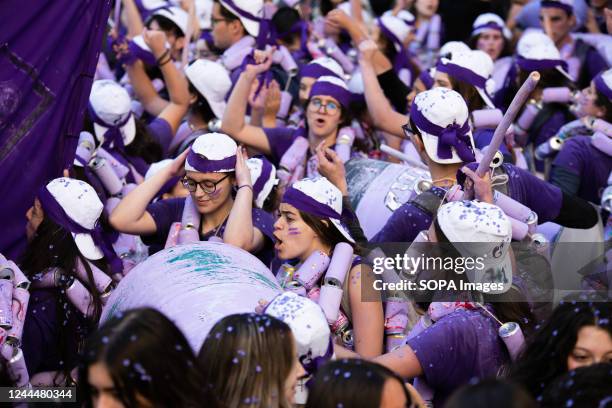 Students are seen singing, partying, and making noise with the colorful cans for each university they represent. Cans Parade of Porto Academic...