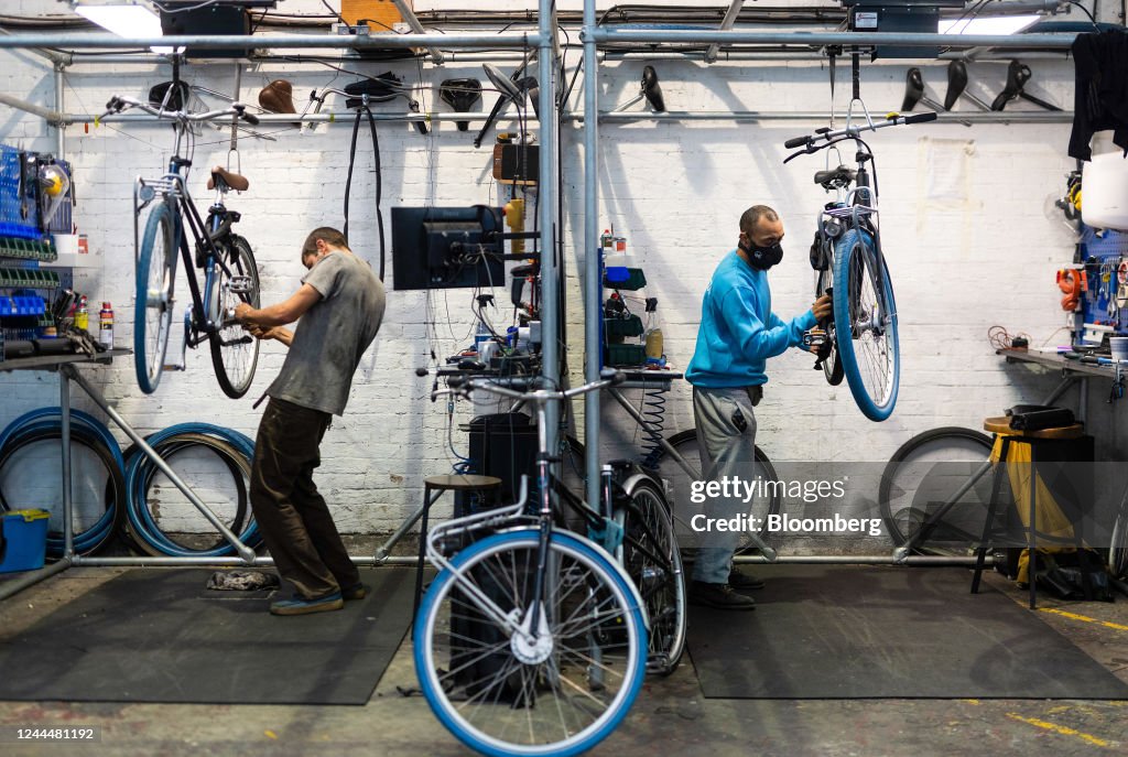 Employees maintain subscription hire bikes at the Swapfiets