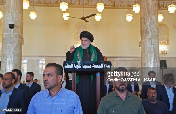 Iraqi Shiite Muslim cleric Muqtada al-Sadr delivers the speech following Friday prayers alongside his supporters at the Great Mosque of Kufa in the...