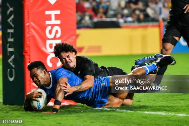 Samoa's Steve Onosai scores a try against New Zealand on the first day of the Hong Kong Sevens rugby tournament on November 4, 2022.