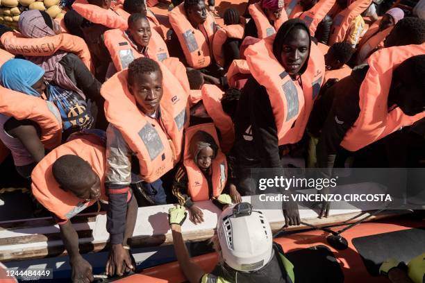 Migrants prepare to get on board the Ocean Viking ship sailing in the international waters off Libya in the Mediterranean Sea, after being rescued by...