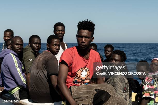 Migrants prepare to get on board the Ocean Viking ship sailing in the international waters off Libya in the Mediterranean Sea, after being rescued by...