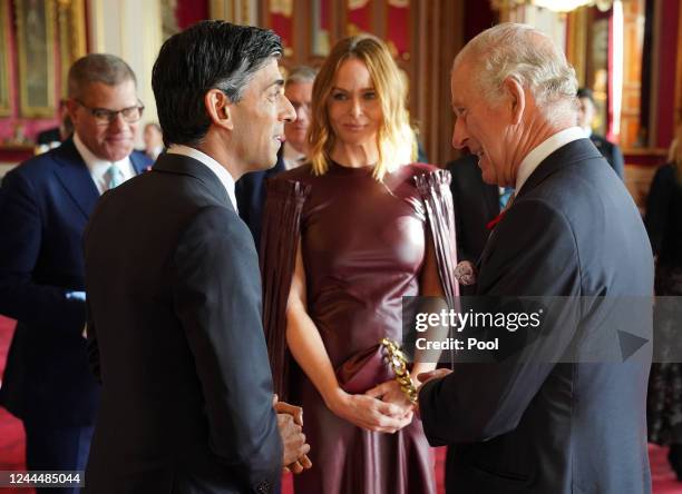 King Charles III speaks with Prime Minister Rishi Sunak, Alok Sharma and Stella McCartney, during a reception ahead of the Cop27 Summit on November 4...