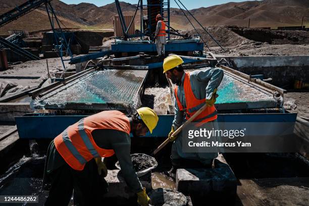 Workers handle the extraction process for chromium, a vital component of stainless steel, extracted from chromite inside the rocks gathered from the...