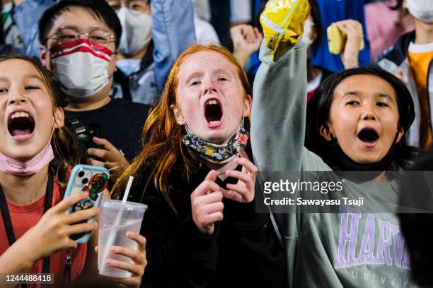 Spectators react during the match of Hong Kong and Australia on day one of the Cathay Pacific/HSBC Hong Kong Sevens at the Hong Kong Stadium on...