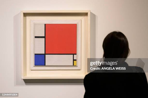 Woman looks at Piet Mondrian's "Composition No. II" during a press preview for Sotheby's November auctions of Modern & Contemporary art in New York...