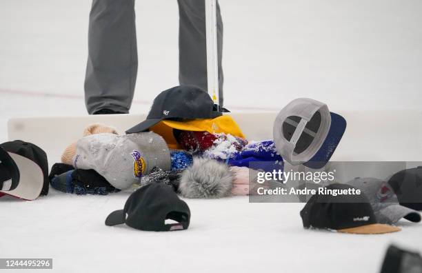 Hats are swept off the ice after a hat-trick goal by Mikko Rantanen of the Colorado Avalanche in the third period against the Columbus Blue Jackets...