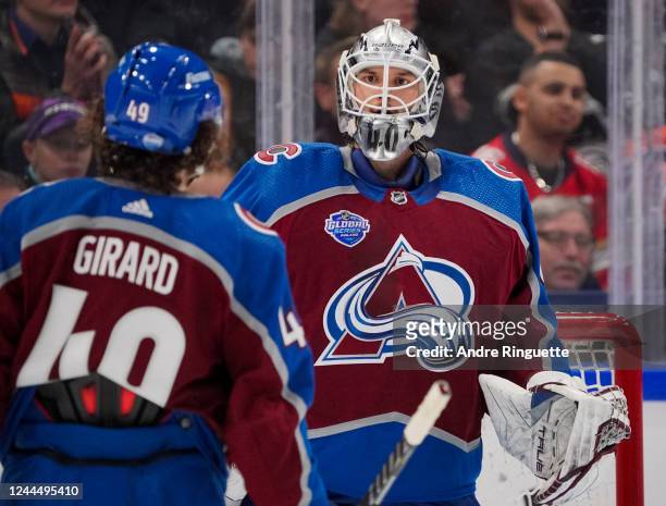 Alexandar Georgiev and Samuel Girard of the Colorado Avalanche celebrate after a 6-3 win against the Columbus Blue Jacketsduring the 2022 NHL Global...
