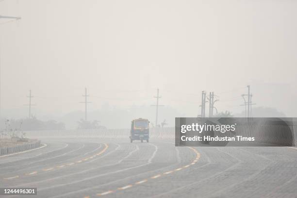 Commuters out on a smoggy morning at Sector 63 on November 4, 2022 in Noida, India. After a grim Thursday, NCR residents woke up to smog-filled...