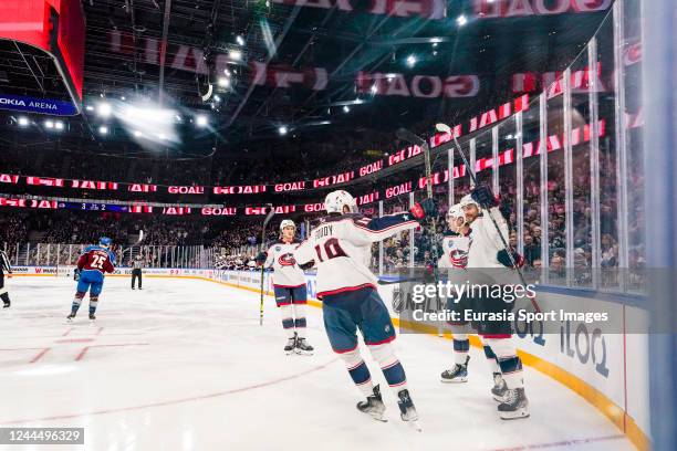 Vladislav Gavrikov of Columbus and Eric Robinson of Columbus celebrates the 3-3 with Liam Foudy of Columbus during the 2022 NHL Global Series -...