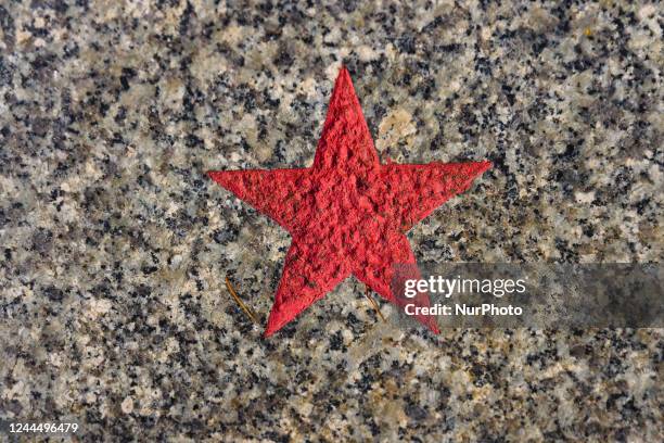 Red star, a symbol of communism and the Soviet Union., is seen on a grave of a soldier of the Soviet army who died in the battle for the liberation...