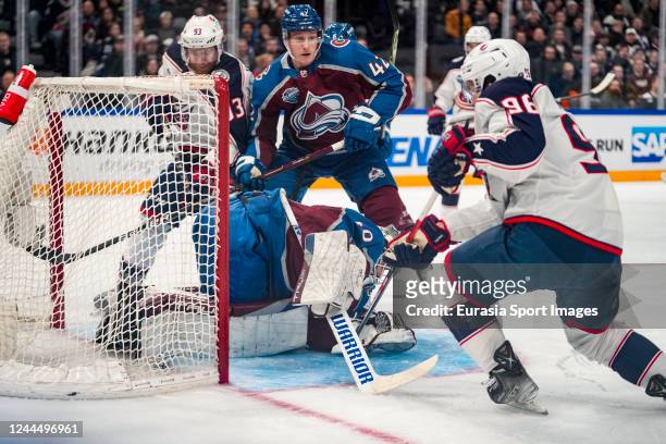 Jack Roslovic of the Columbus Blue Jackets tries to beat goalkeeper Alexandar Georgiev of the Colorado Avalanche during the 2022 NHL Global Series -...