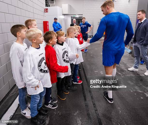 Mikko Rantanen of the Colorado Avalanche high-fives a group of local kids following a 6-3 win against the Columbus Blue Jackets during the 2022 NHL...
