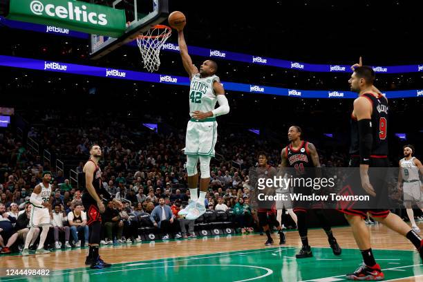 Al Horford of the Boston Celtics dunks as Chicago Bulls defenders look on during the first quarter at TD Garden on November 4, 2022 in Boston,...