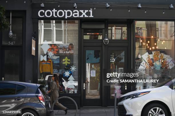 Pedestrian walk pass cotopaxi in the Hayes Valley neighborhood of San Francisco, California, on November 2, 2022. - When an upmarket clothing brand...