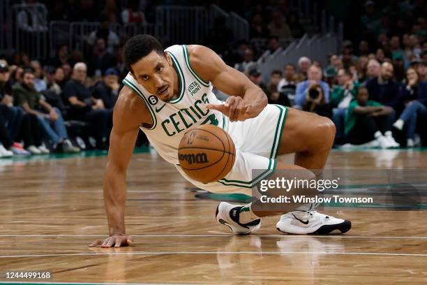 Malcolm Brogdon of the Boston Celtics slips while dribbling the ball during the second quarter of the game against the Chicago Bulls at TD Garden on...