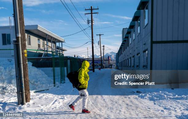 People walk through a snowy downtown on November 04, 2022 in Anchorage, Alaska. Early and absentee voting has begun in Alaska for the decisive...