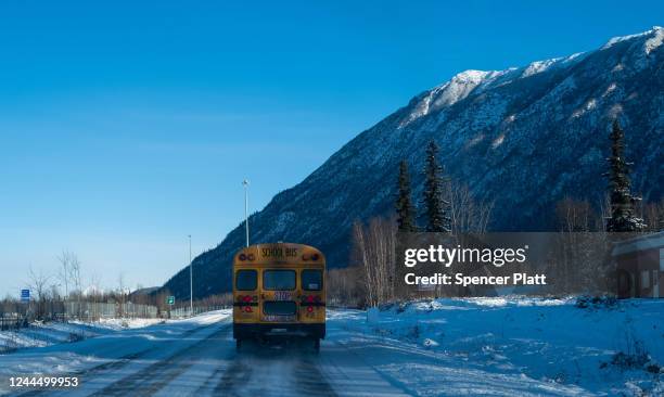 School bus drives along a snow covered road on November 04, 2022 in Wasilla, Alaska. Early and absentee voting has begun in Alaska for the decisive...