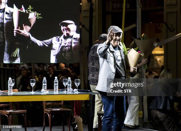 Spaniard singer-songwriter Joan Manuel Serrat waves during the inauguration of the "Paseo Fontanarrosa-Serrat" at the corner of El Cairo bar in...