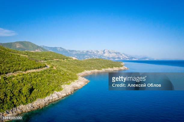 aerial view of sea and fantastic rocky coast, montenegro. shot from air. - budva stock pictures, royalty-free photos & images