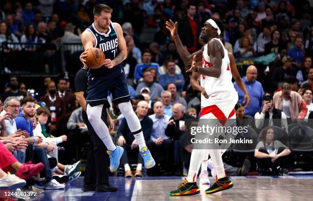 Luka Doncic of the Dallas Mavericks bounces a ball off Pascal Siakam of the Toronto Raptors to maintain possession in the second half of the game at...