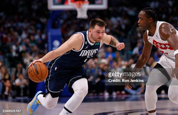 Luka Doncic of the Dallas Mavericks handles the ball as O.G. Anunoby of the Toronto Raptors defends in the second half of the game at American...