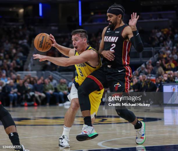 McConnell of the Indiana Pacers dribbles the ball against Gabe Vincent of the Miami Heat at Gainbridge Fieldhouse on November 4, 2022 in...