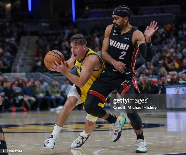 McConnell of the Indiana Pacers dribbles the ball against Gabe Vincent of the Miami Heat at Gainbridge Fieldhouse on November 4, 2022 in...