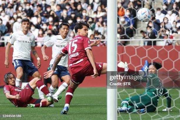 Yokohama F Marinos player Takuma Nishimura scores the team's second goal during the Japanese professional J-League football match between the...