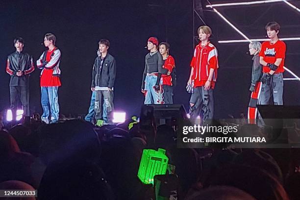 This picture taken on November 4, 2022 shows members of K-pop music group NCT127 performing in Serpong, Banten province, before the concert was...