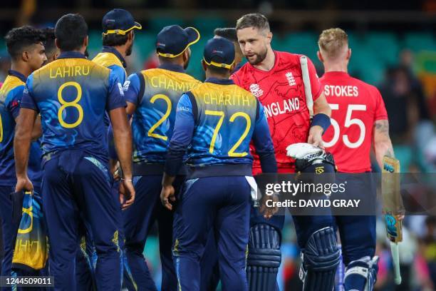 Englands Ben Stokes walks off as teammate Chris Woakes shakes hands with players from Sri Lanka after winning the ICC men's Twenty20 World Cup 2022...