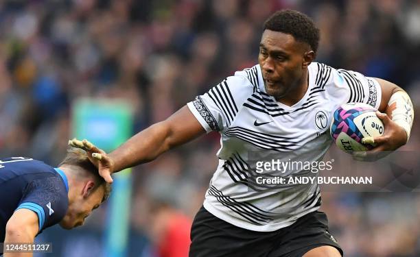 Fiji's number 8 Viliame Mata attempts to hold off Scotland's wing Darcy Graham during the Autumn Nations Series International rugby union match...