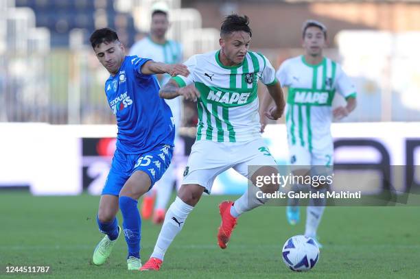 Fabiano Parisi of Empoli FC battles for the ball with Luca D'Andrea of US Sassuolo during the Serie A match between Empoli FC and US Sassuolo at...